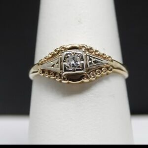14k solid yellow Gold and diamond Ring

2 grams